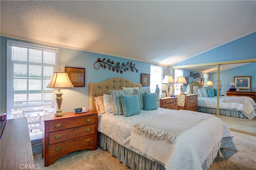 1675 Los Osos Valley Road, Unit 223 Los Osos, CA 93402 - Photo 40 of 68 a bedroom with a large bed and a window