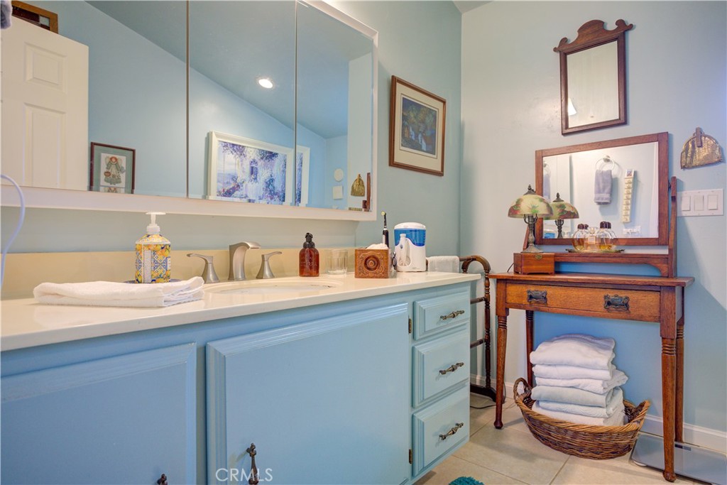 1675 Los Osos Valley Road, Unit 223 Los Osos, CA 93402 - Photo 43 of 68 a bathroom with a sink and a mirror