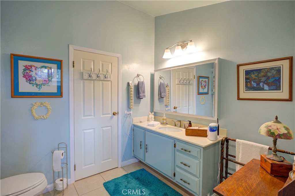 1675 Los Osos Valley Road, Unit 223 Los Osos, CA 93402 - Photo 46 of 68 a spacious bathroom with a double vanity sink and a mirror