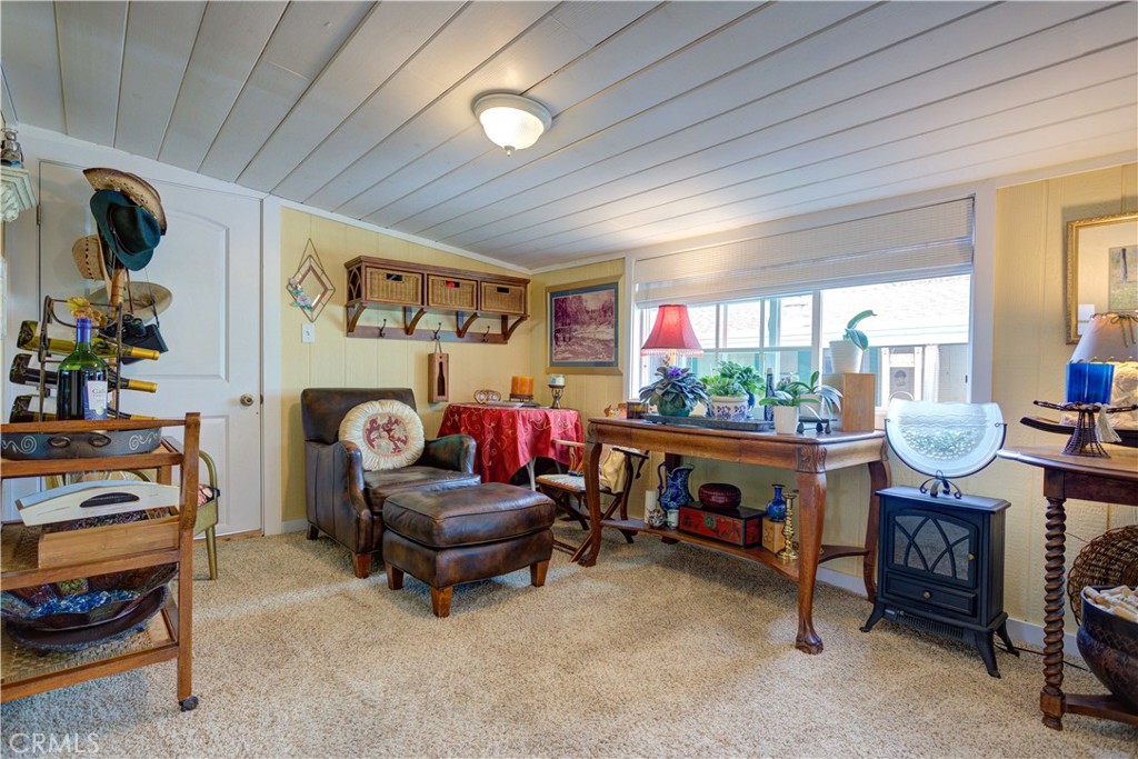 1675 Los Osos Valley Road, Unit 223 Los Osos, CA 93402 - Photo 49 of 68 a living room with furniture and a flat screen tv