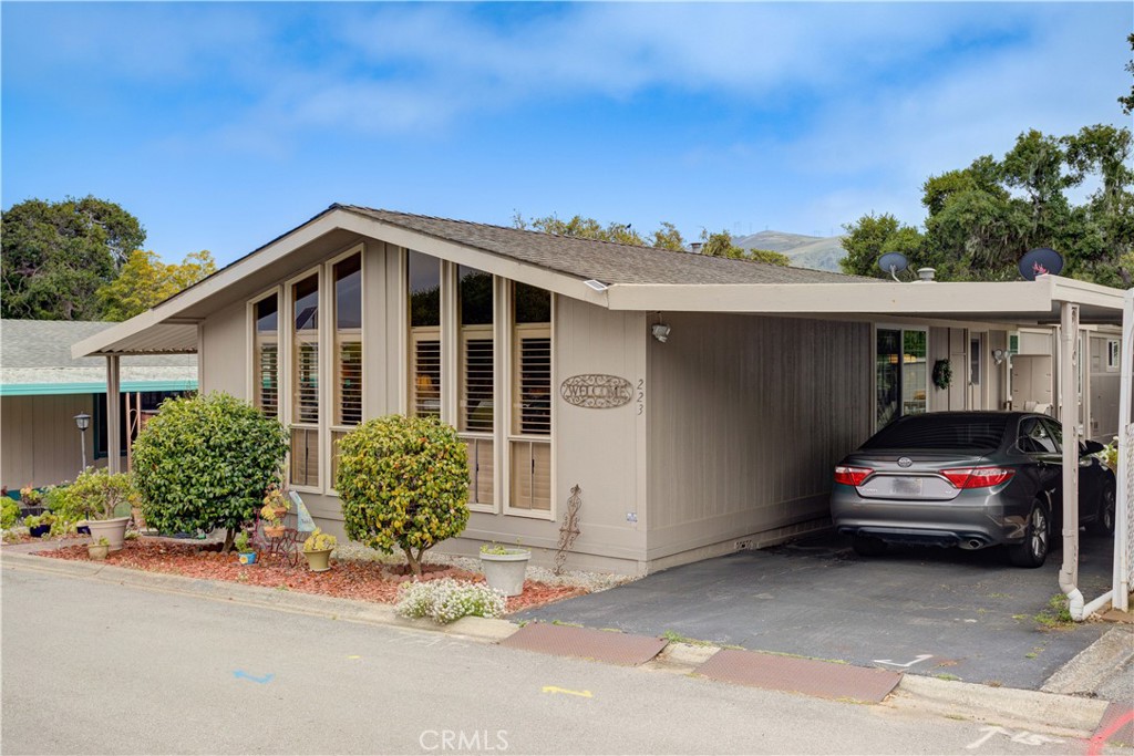 1675 Los Osos Valley Road, Unit 223 Los Osos, CA 93402 - Photo 5 of 68 a front view of a house with a garden