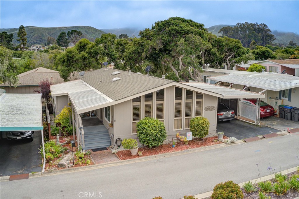 1675 Los Osos Valley Road, Unit 223 Los Osos, CA 93402 - Photo 56 of 68 an aerial view of a house with a yard and garage