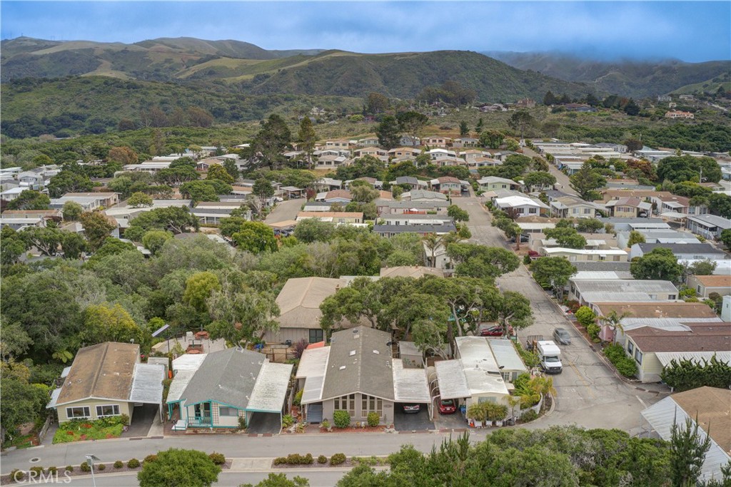 1675 Los Osos Valley Road, Unit 223 Los Osos, CA 93402 - Photo 61 of 68 an aerial view of residential houses with outdoor space and trees