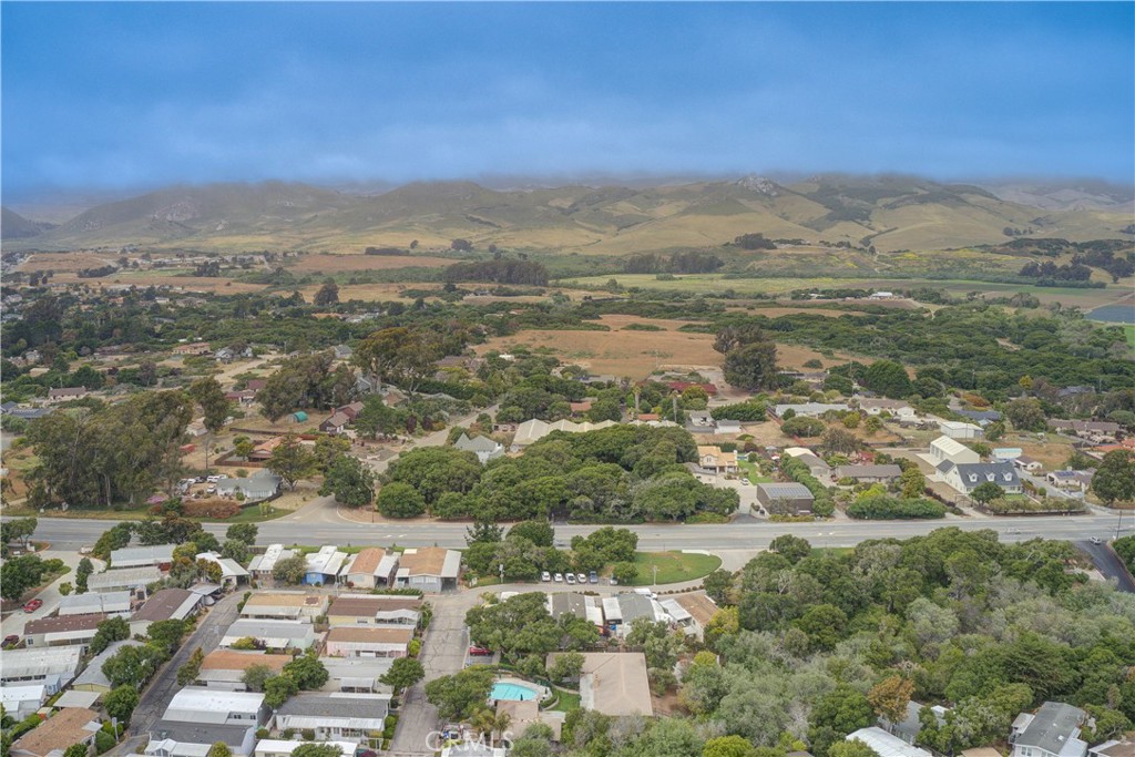 1675 Los Osos Valley Road, Unit 223 Los Osos, CA 93402 - Photo 66 of 68 an aerial view of residential houses with outdoor space and trees