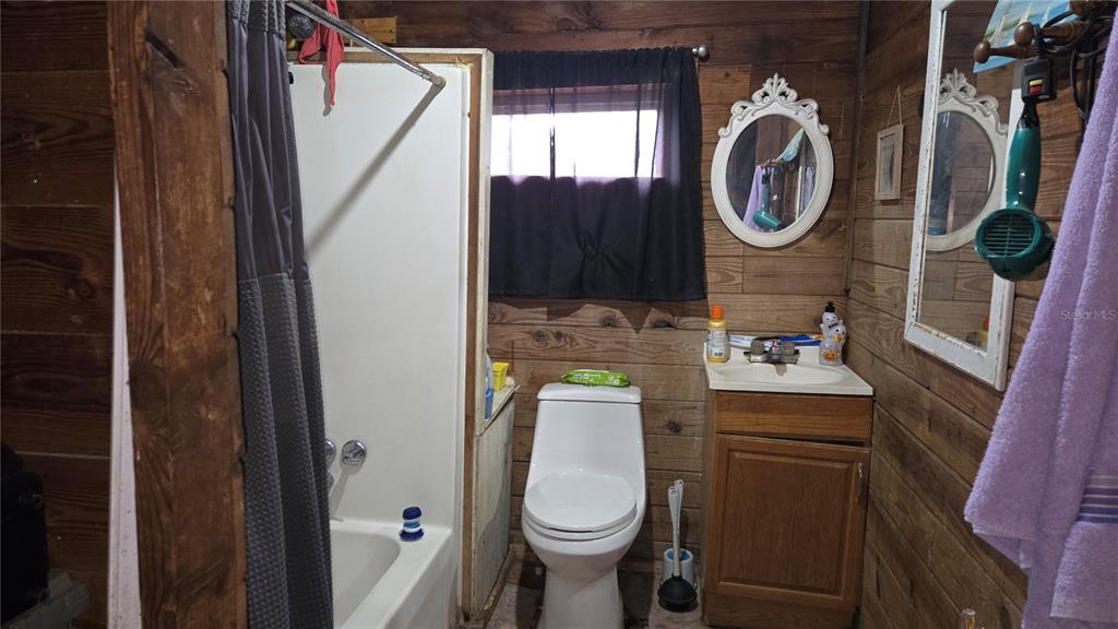 883 Northeast Maple Lane Lake City, FL 32055 - Photo 13 of 14 a bathroom with a toilet and a sink