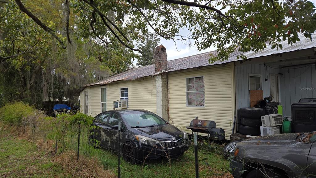 883 Northeast Maple Lane Lake City, FL 32055 - Photo 2 of 14 a view of backyard of house with outdoor seating
