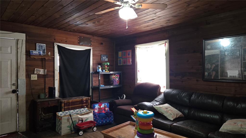883 Northeast Maple Lane Lake City, FL 32055 - Photo 4 of 14 a living room with furniture and a window