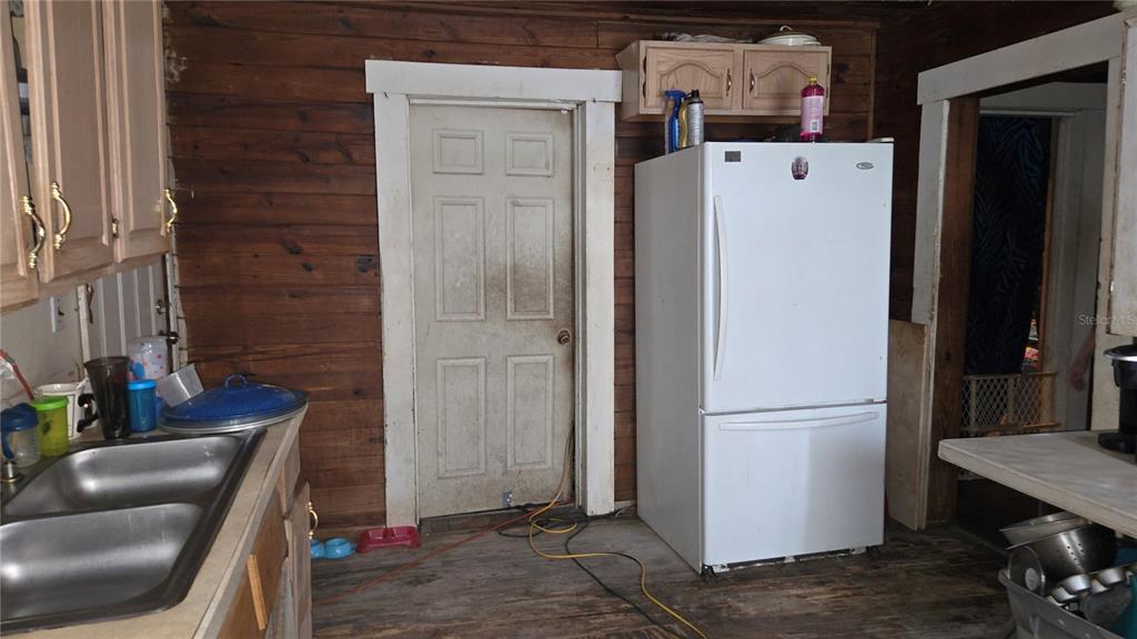 883 Northeast Maple Lane Lake City, FL 32055 - Photo 10 of 14 a refrigerator freezer sitting inside of a kitchen