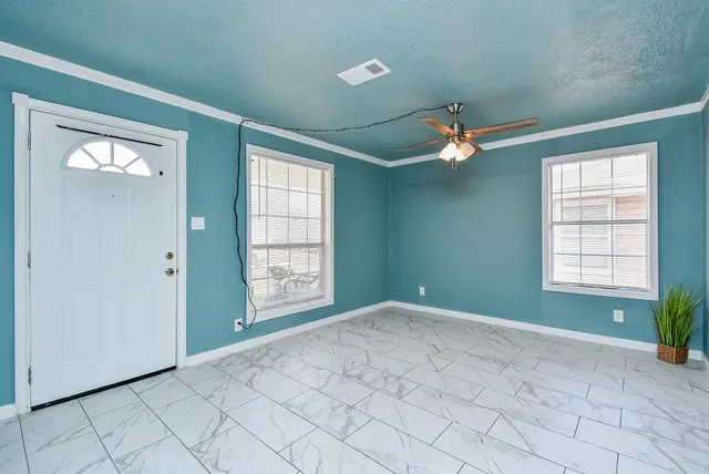 a view of an empty room with a window