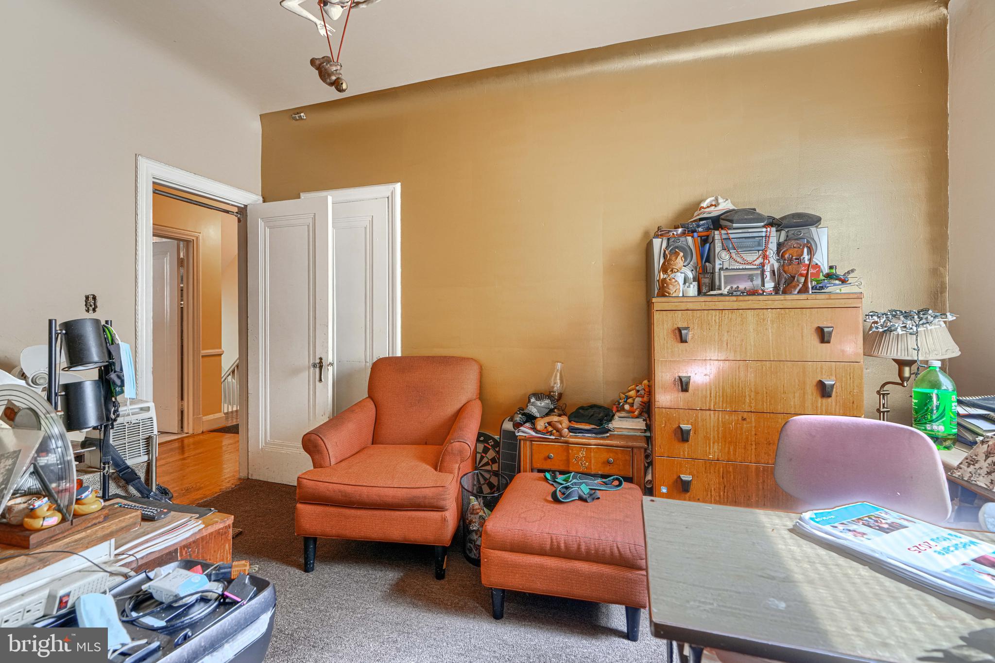 3212 Dorchester Road Baltimore, MD 21215 - Photo 29 of 45 a living room with furniture and a flat screen tv