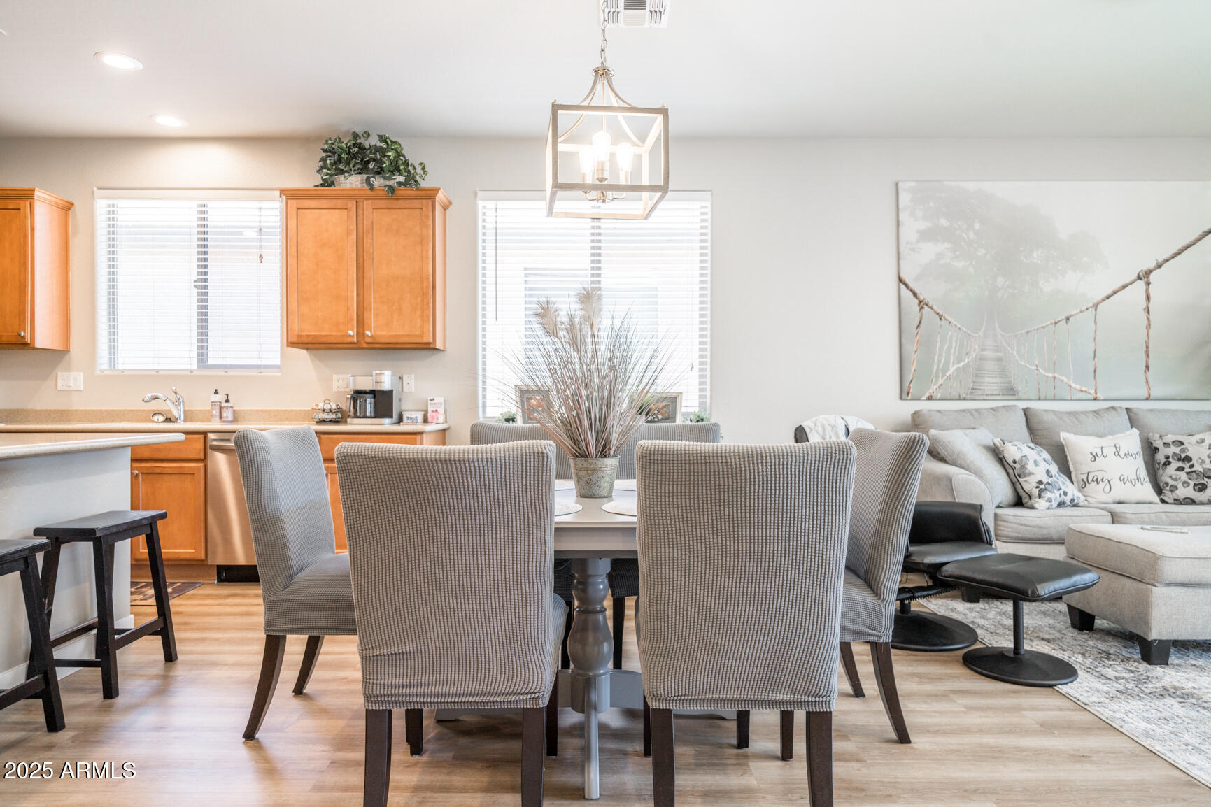6375 West Heritage Way Florence, AZ 85132 - Photo 11 of 36 a view of a dining room with furniture and wooden floor