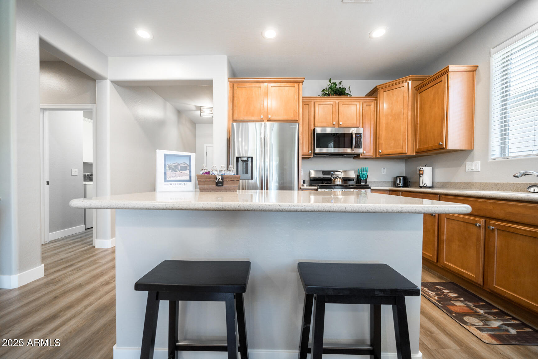 6375 West Heritage Way Florence, AZ 85132 - Photo 16 of 36 a kitchen with a table chairs refrigerator and microwave
