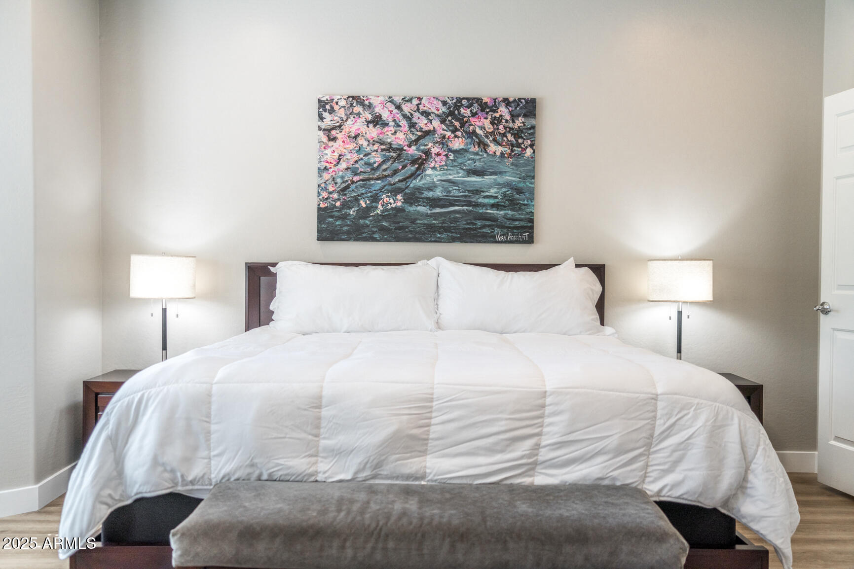 6375 West Heritage Way Florence, AZ 85132 - Photo 17 of 36 a large white bed in a bedroom next to a lamp