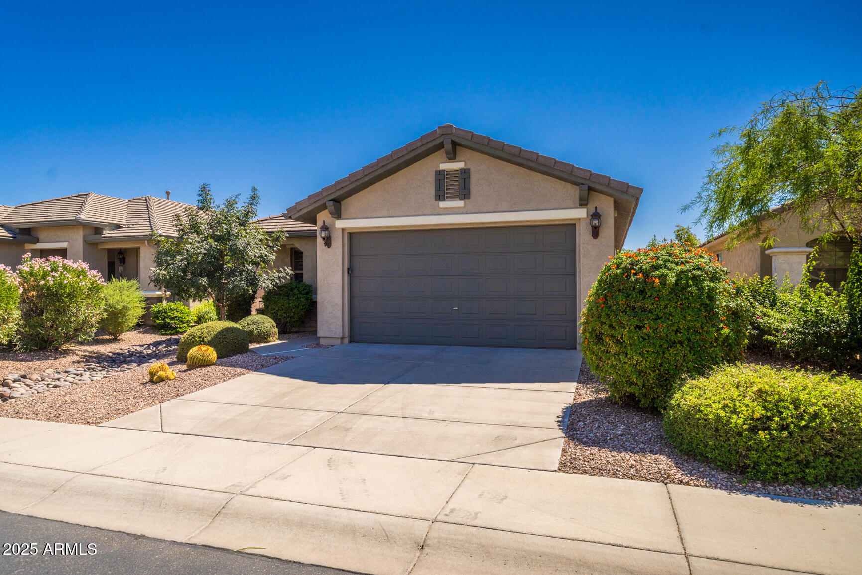 6375 West Heritage Way Florence, AZ 85132 - Photo 2 of 36 a front view of a house with a yard
