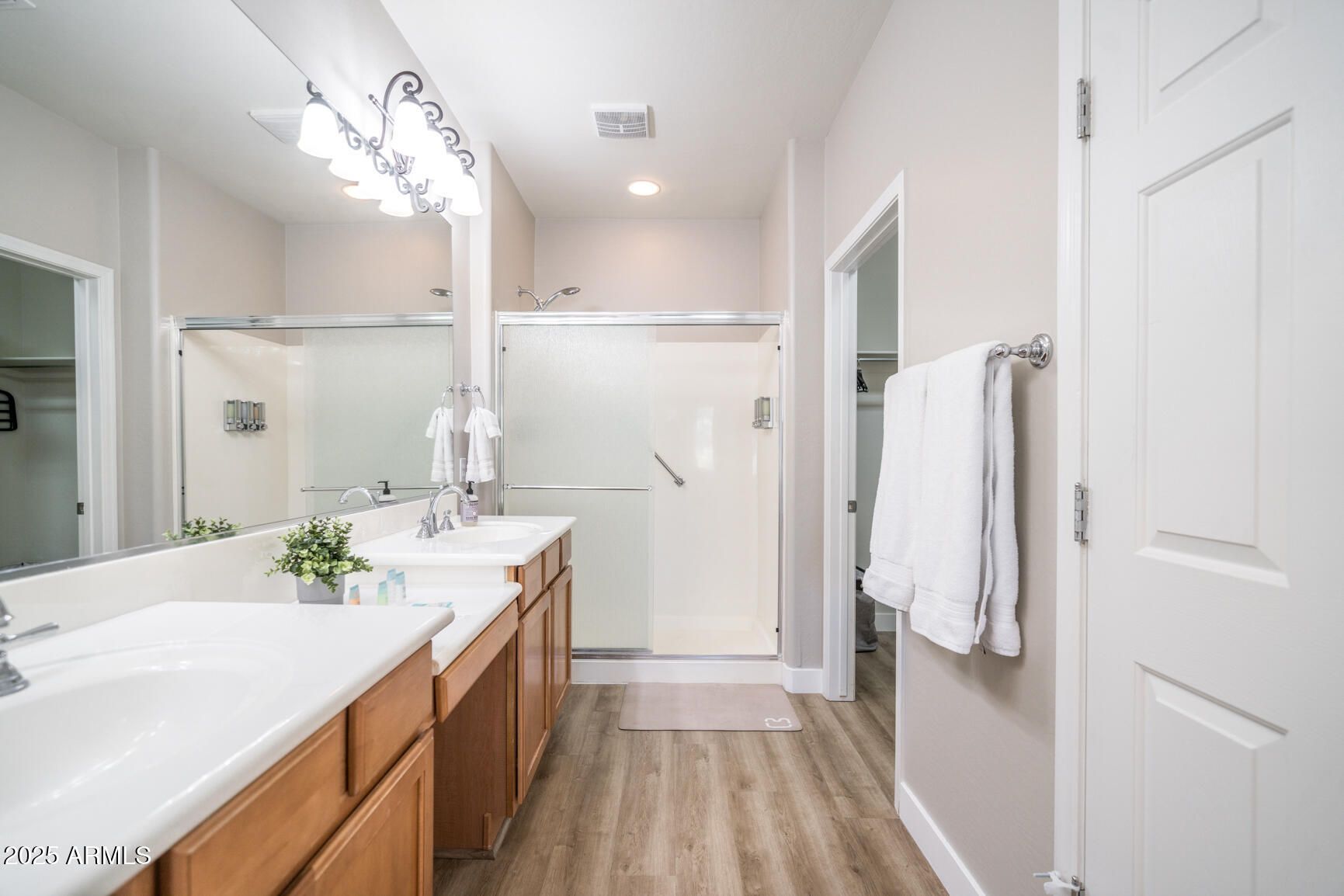 6375 West Heritage Way Florence, AZ 85132 - Photo 28 of 36 a bathroom with a double vanity sink and mirror