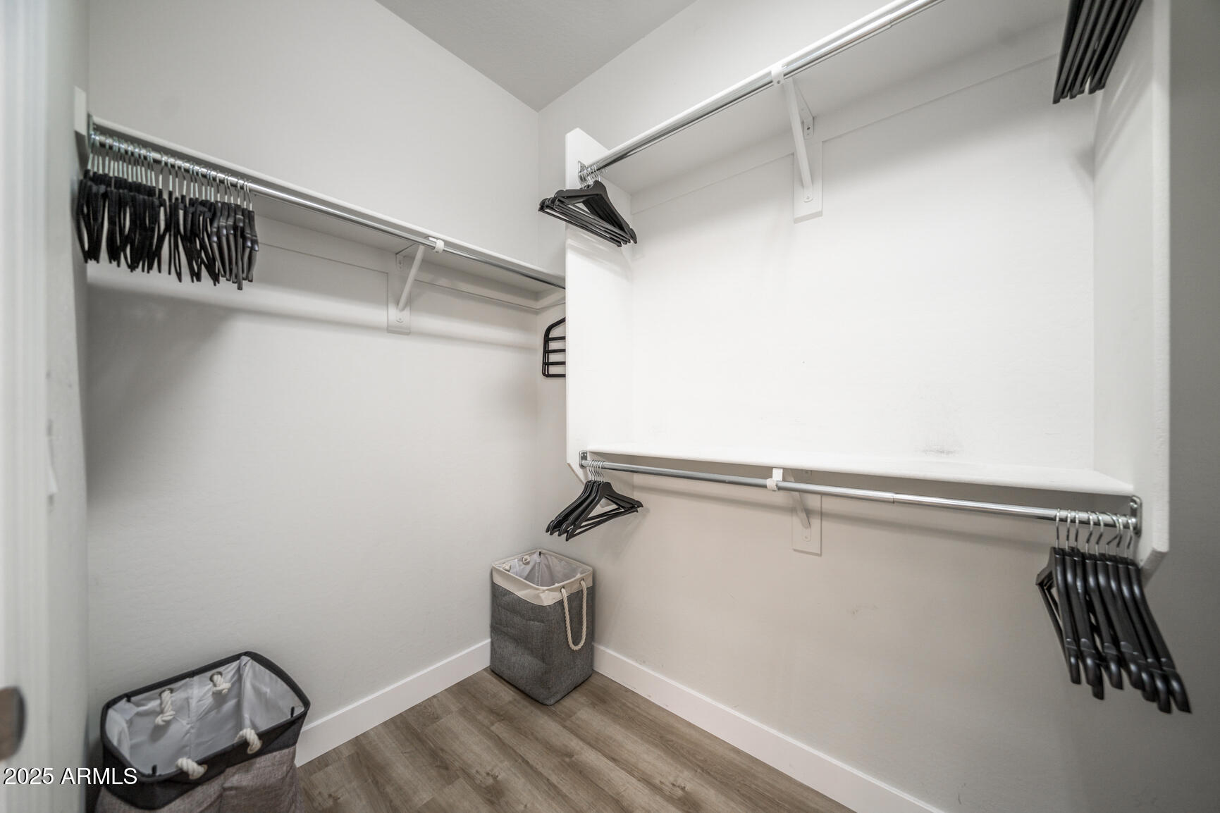 6375 West Heritage Way Florence, AZ 85132 - Photo 33 of 36 a view of walk in closet with clothes and shoes