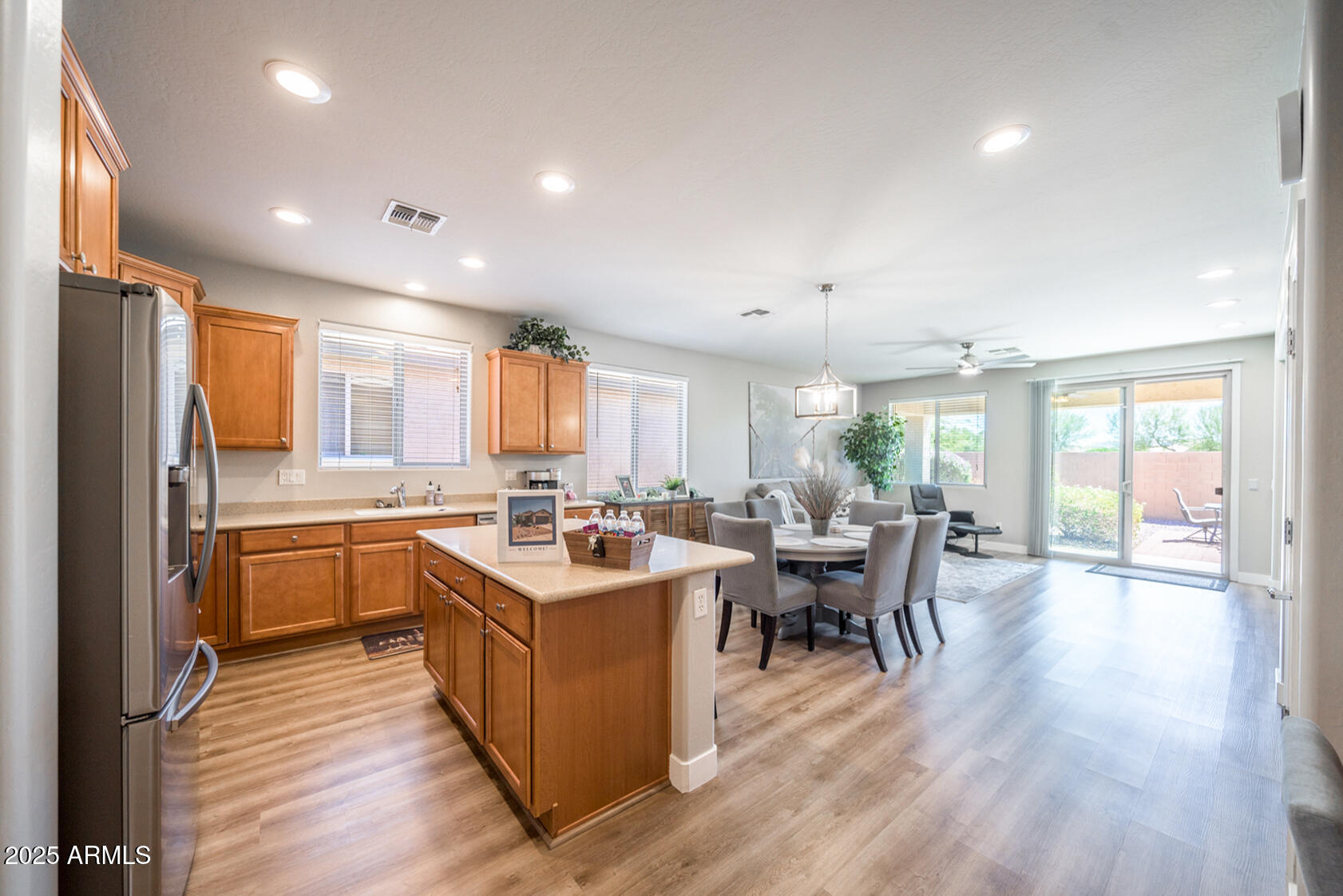 6375 West Heritage Way Florence, AZ 85132 - Photo 7 of 36 a kitchen with lots of counter top space and wooden floor
