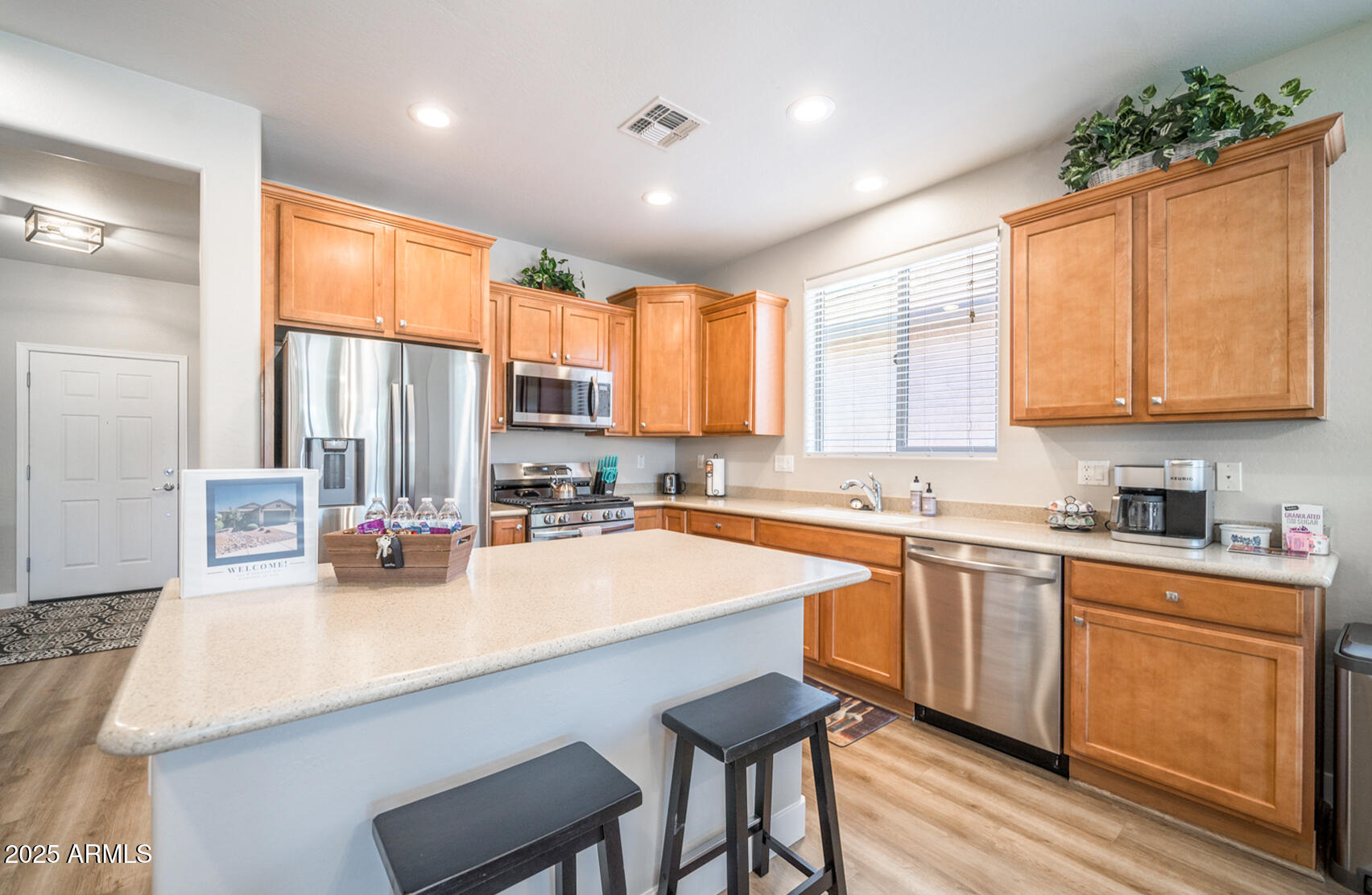 6375 West Heritage Way Florence, AZ 85132 - Photo 10 of 36 a kitchen with sink a window and chairs