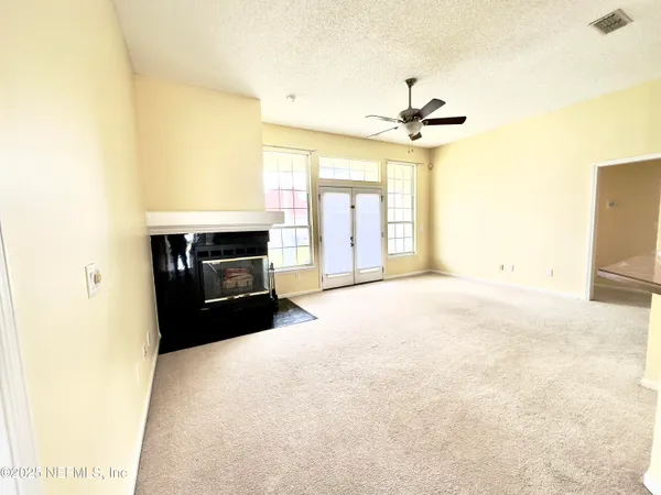 a view of an empty room with a window