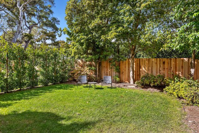 a backyard of a house with lots of green space