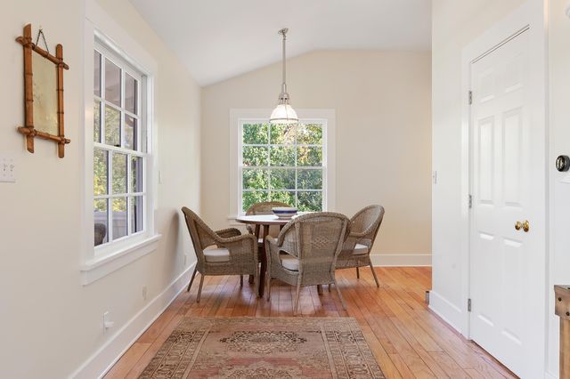 a dining room with furniture window wooden floor