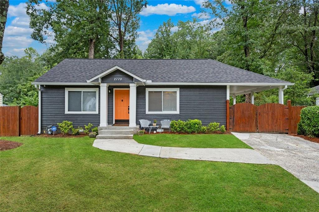 a front view of a house with a garden