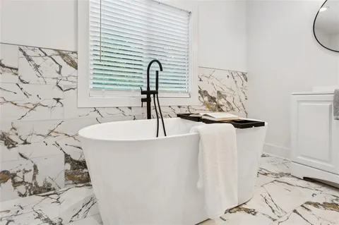 a close view of a sink a faucet and a table in a room