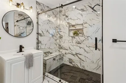 a bathroom with a sink and a mirror