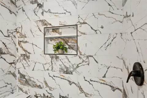 a bathroom sink a mirror and vanity