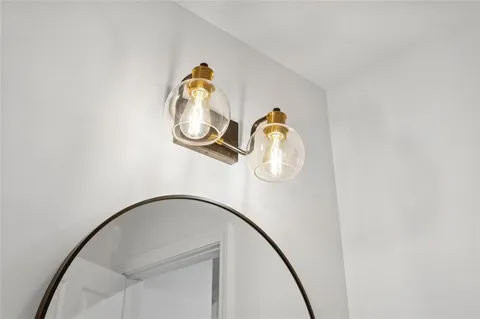 a bathroom with a sink a toilet and shower curtain