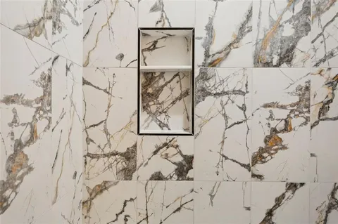 a view of a backyard with a large tree