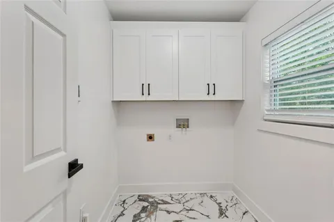 a view of a yard with a wooden fence