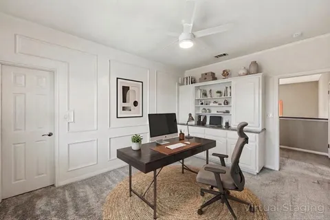 a view of a workspace with furniture