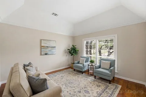 a living room with furniture and a rug