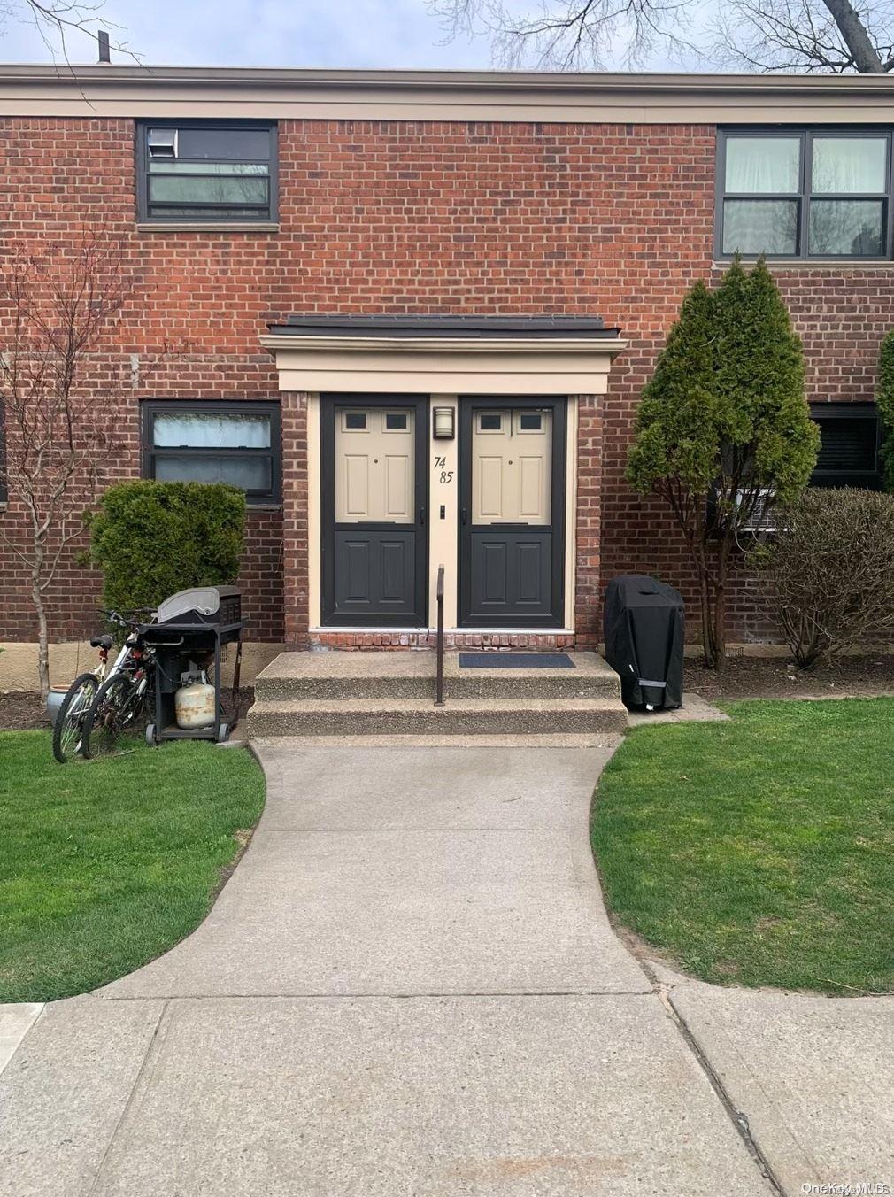 74-85 220th Street, Unit 1 Queens, NY 11364 - Photo 1 of 1 a view of a house with backyard porch and garden