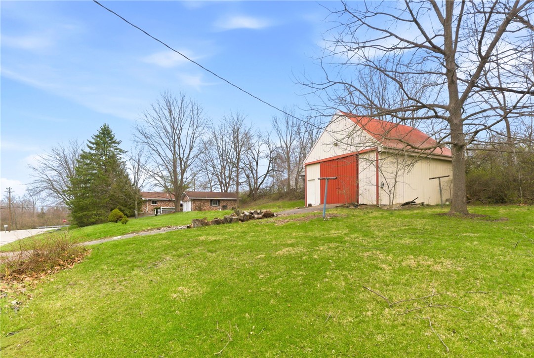 6711 Hamilton-Middletown Road Franklin, OH 45005 - Photo 37 of 49 This expansive property offers a charming barn and ample green space, perfect for outdoor pursuits.