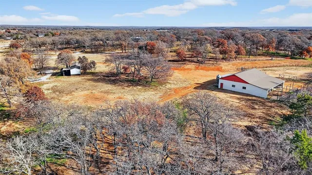 a view of a swimming pool with an outdoor seating and a kitchen