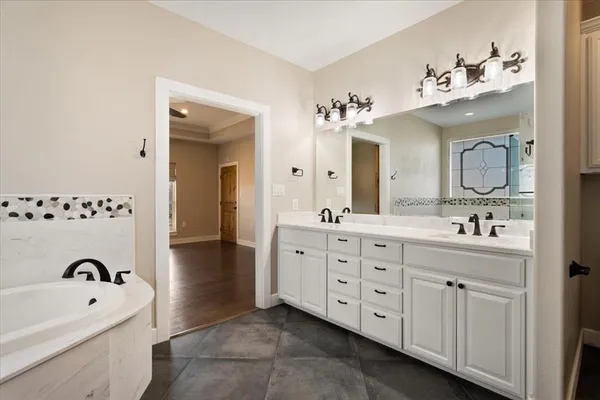 a bathroom with a shower and a mirror