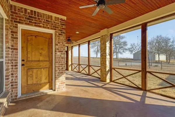 a view of a house with a yard porch and sitting area