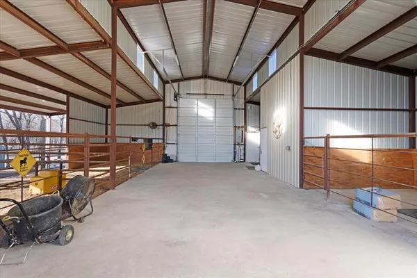 a view of empty room with wooden walls