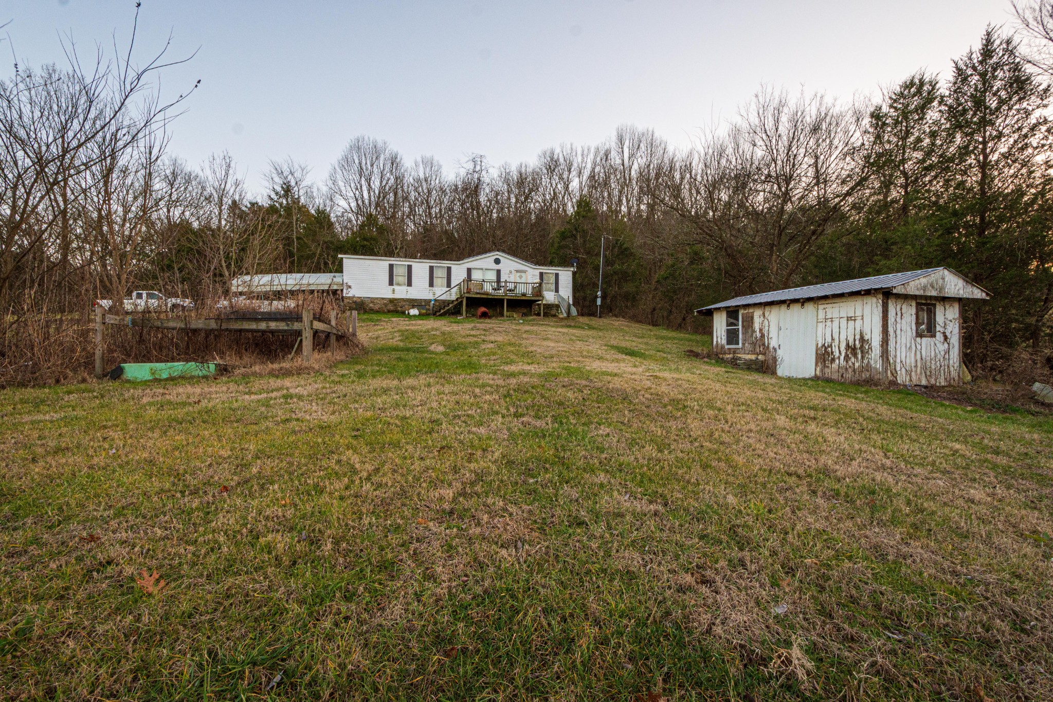 1680 Access Road Pulaski, TN 38478 - Photo 6 of 25 a house with trees in front of it