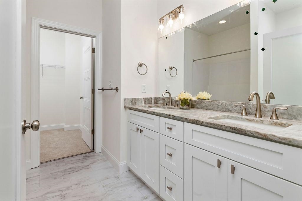 833 Faber Avenue Waynesboro, VA 22980 - Photo 15 of 36 a bathroom with a granite countertop sink a mirror and a shower