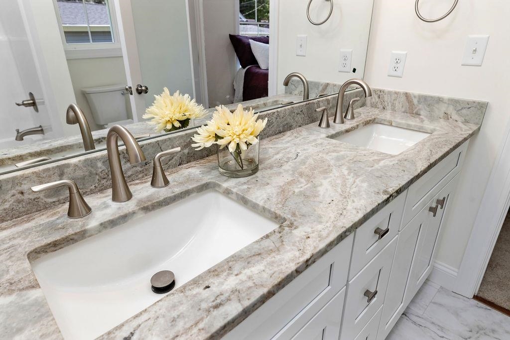 833 Faber Avenue Waynesboro, VA 22980 - Photo 19 of 36 a bathroom with a granite countertop sink and a mirror