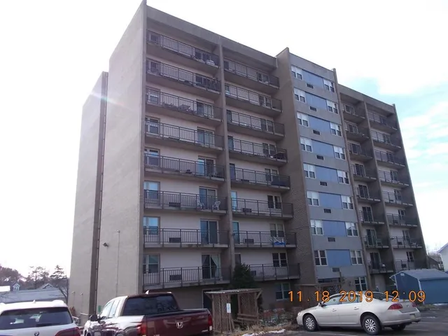 a view of street with parked cars