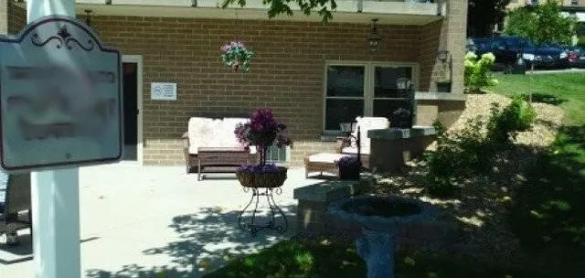 a backyard of a house with outdoor seating