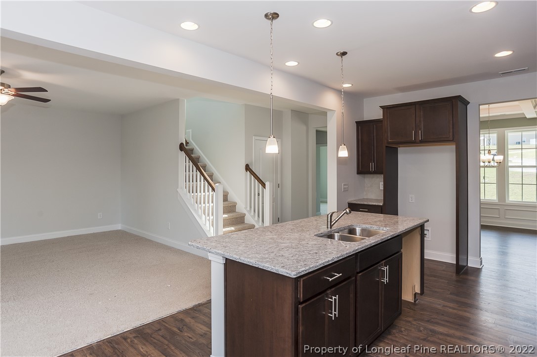 454 Pittfield Run Cameron, NC 28326 - Photo 15 of 37 a kitchen with a sink a refrigerator and a stove