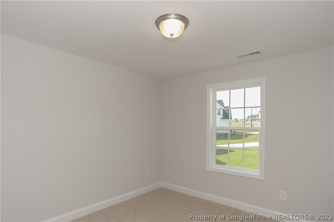 454 Pittfield Run Cameron, NC 28326 - Photo 18 of 37 an empty room with a window