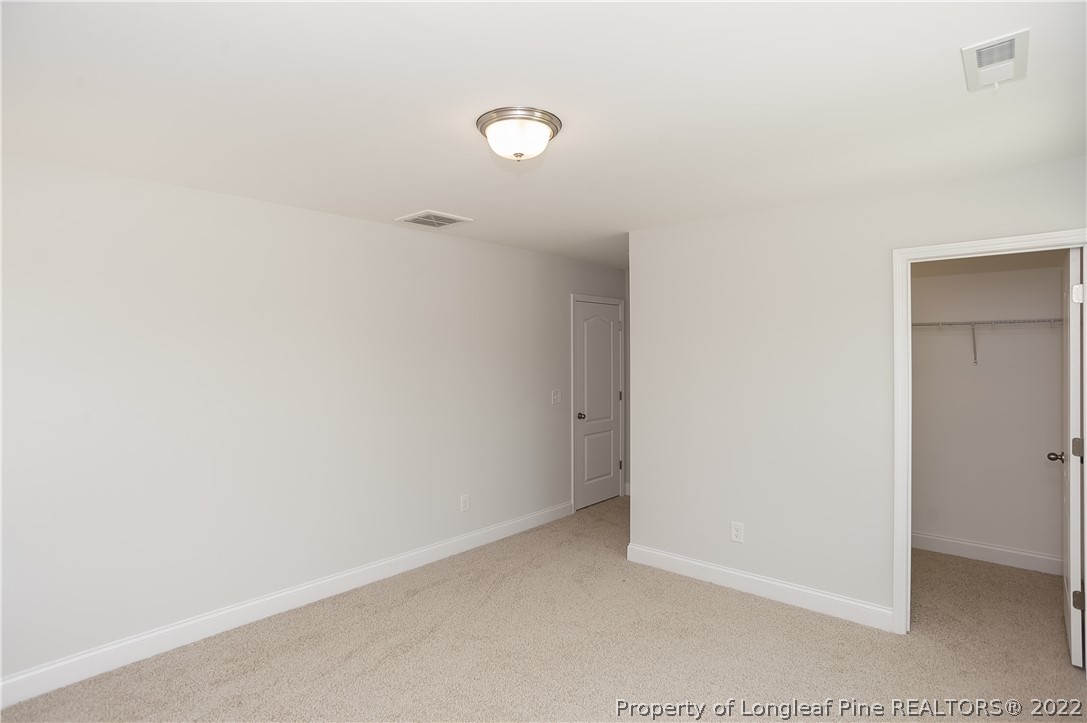 454 Pittfield Run Cameron, NC 28326 - Photo 23 of 37 a view of an empty room