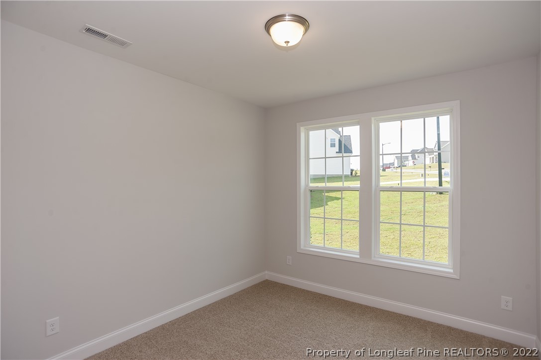 454 Pittfield Run Cameron, NC 28326 - Photo 5 of 37 an empty room with a window