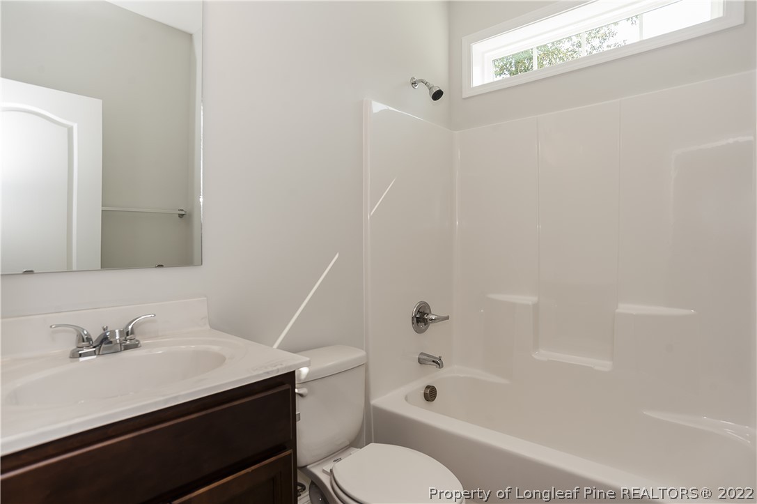 454 Pittfield Run Cameron, NC 28326 - Photo 8 of 37 a bathroom with a sink toilet vanity and bathtub